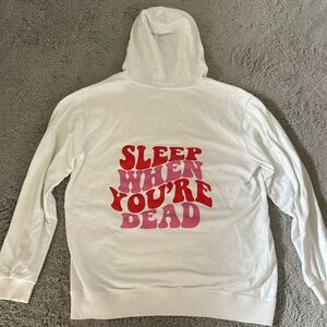 White hoodie with quote on back